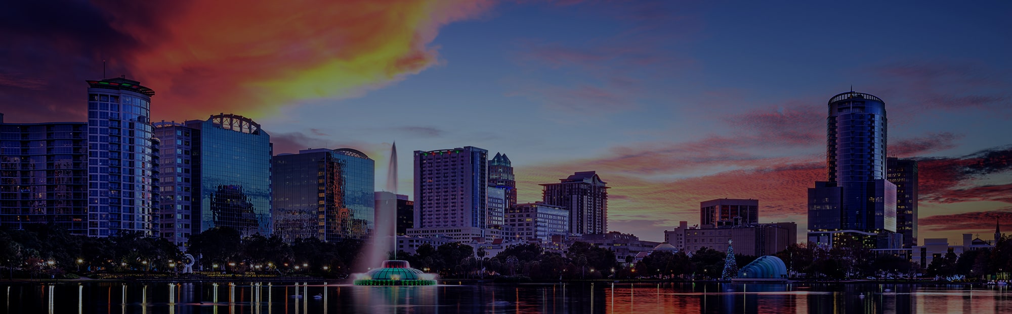 Orlando, Florida, USA downtown city skyline from Eola Park.